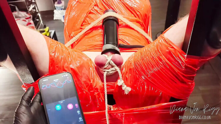 Diana Von Rigg Merciless Cock Milking - Tight Shiny Red Plastic Mummification & Remote Anal Stimulation