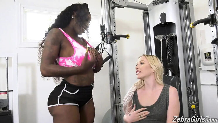 Dixie Lynn and Ebony Mystique fuck with a strapon in the gym